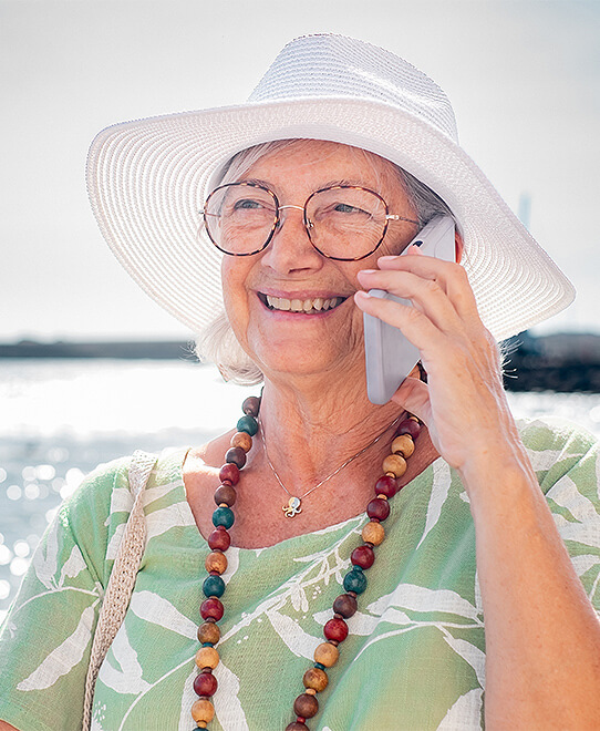 Woman on phone to WBOA enjoying life